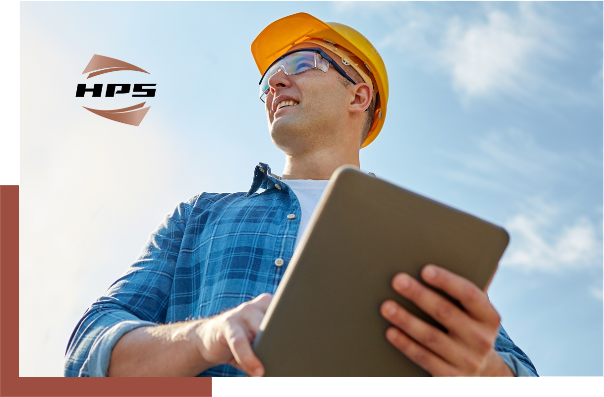 Man in hard hat holding a tablet